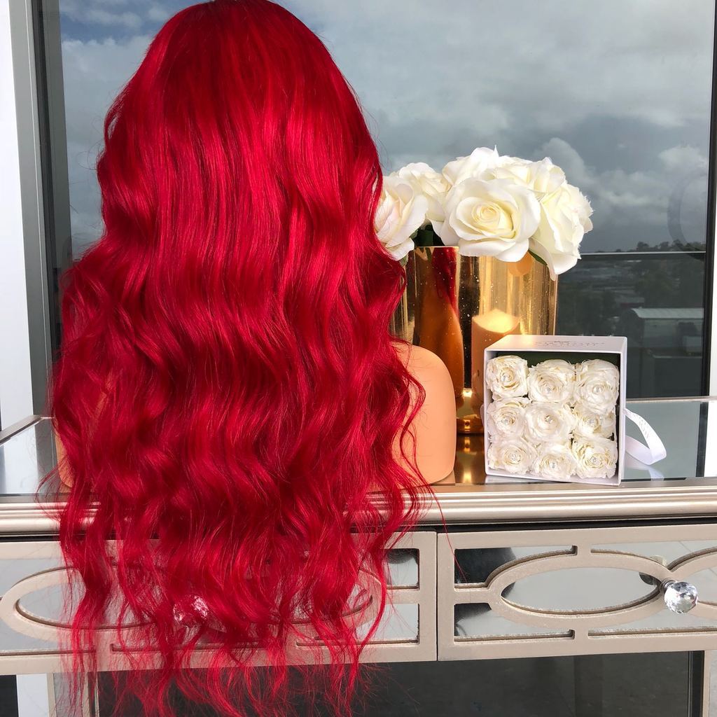 A big wavy red wig